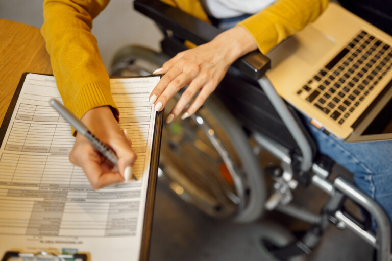 disabled student in wheelchair writes in notebook 2021 10 04 22 17 54 utc 1 scaled